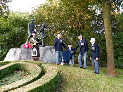 Piper Grant of The Highlanders, plays a lament for ex CSM James Petrie age 89, Reginald Leadbeater MM aged 94, Richard Massey aged 84 and Derek Suggate aged 84 at the Highland Division memorial, Schijndel, Holland, October 2009. The 65th anniversary of Liberation.