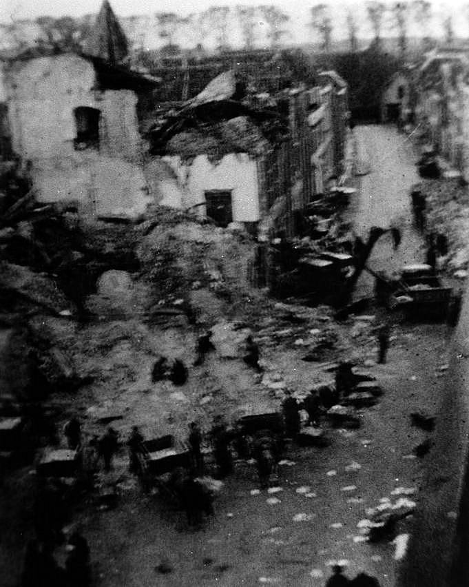 Camerons help to clear the rubble of the Town Hall, Heusden, Holland, November 1944