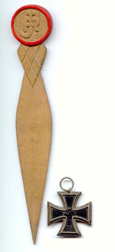 carved replica knife and Iron cross given to John Raine by German Prisoner.