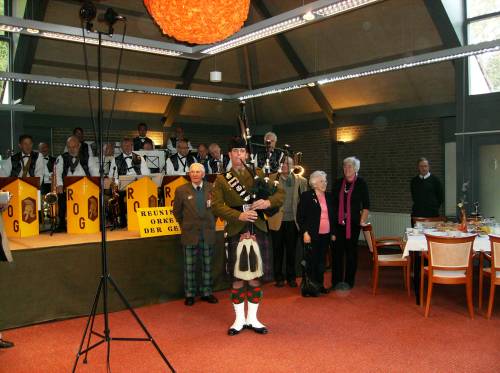Piper Grant, The Highlanders, 4th battalion the Royal Regiment of Scotland, plays the Highland Division veterans to their lunch at Huize Bergen, Vught.