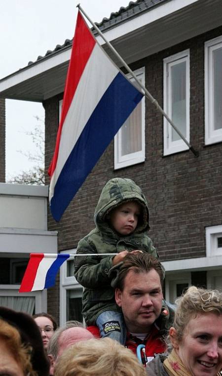 The people of Vught line the streets to applaud and greet the 51st Highland Division veterans on their parade of honour