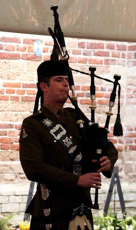Piper Grant, The Highlanders, 4th battalion the Royal Regiment of Scotland plays the lament 'Flowers of the Forest' at the Lambertus Tower, Vught.