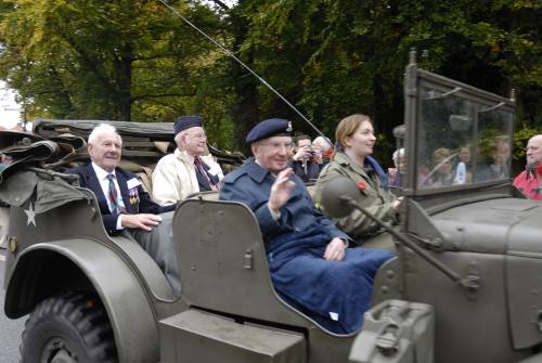 3 veterans of 51st Highland Division, James Duffus,( front seat), Royal Artillery, with Derek Suggate and James Petrie, both 5th battalion Queens Own Cameron Highlanders,( back seat) on the parade of honour, Vught October 2009.