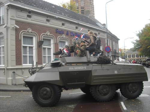 Some of the children of Vught enjoying joining in with the veterans on their parade of honour, Vugh,t Holland. October 2009.