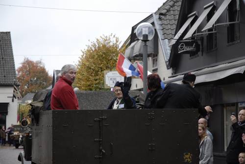 Arthur Rowledge, ex 5th battalion, Queens Own Cameron Highlanders, waves to the crowds from the back of a WW2 truck, 51st Highland Division veterans parade of honour, Vught, Holland, October 2009.